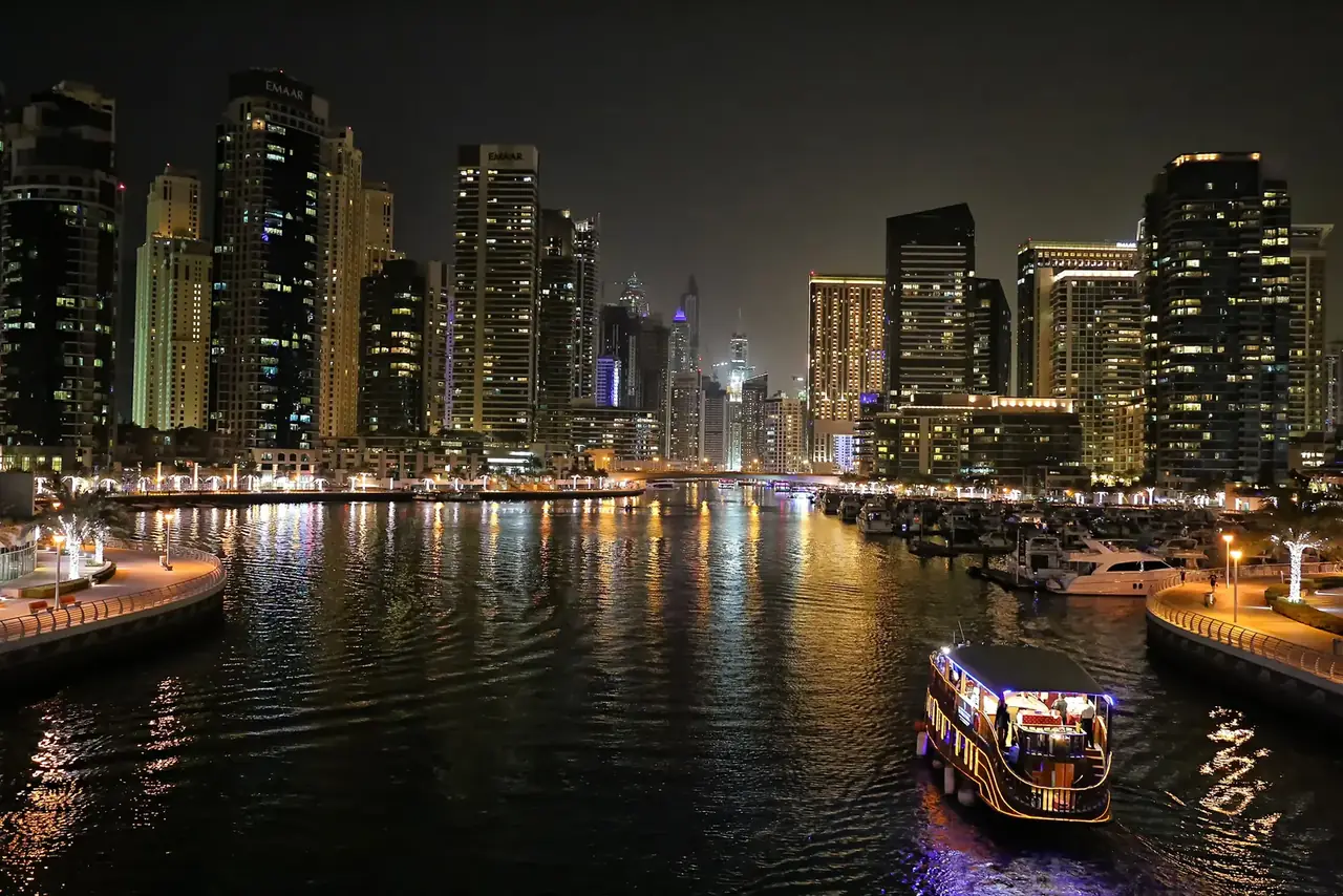 Dubai Marina towers and canal at night