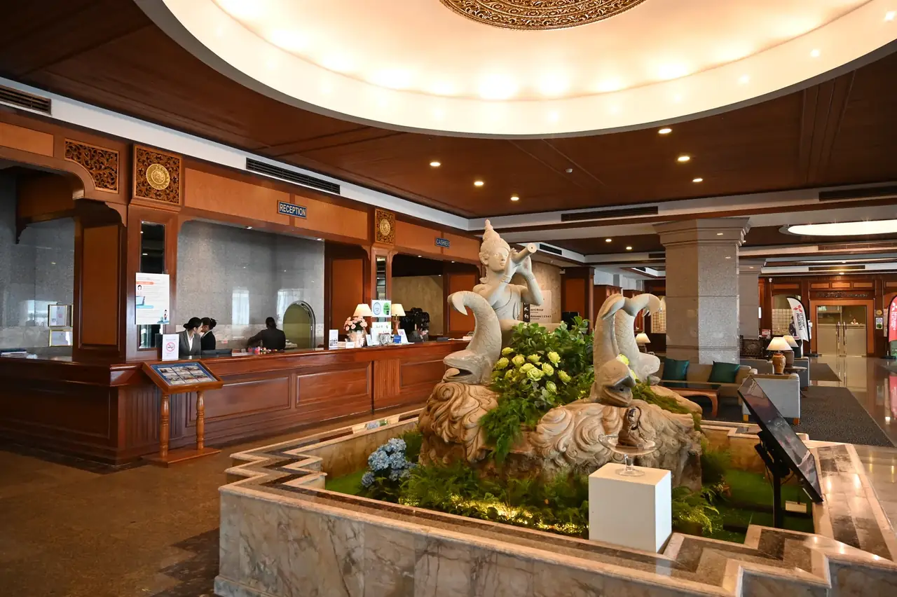 Grand hotel lobby with marble and chandelier